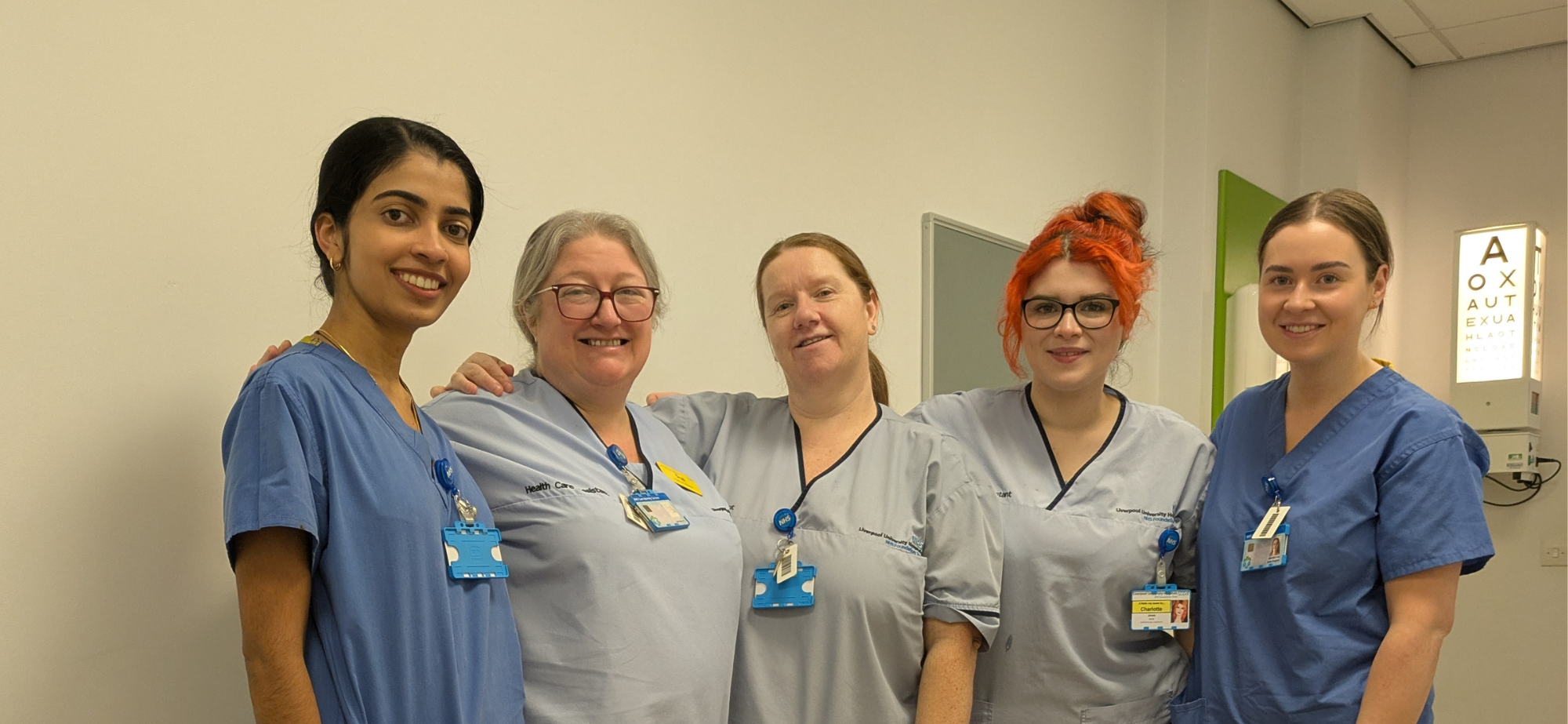 Susan Millard posing for a photograph with four of her colleagues in the Eye Unit at Aintree University Hospital